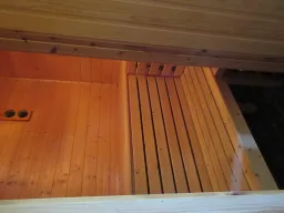 Wooden sauna with sauna heater